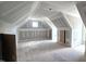 Large, unfinished bonus room has dormer windows to provide an inviting area to create a customized living space at 55 Livingston Ln, Spring Hope, NC 27882
