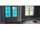 Entryway view with wood-look floors, blue painter's tape, a window, and unfinished french doors at 55 Livingston Ln, Spring Hope, NC 27882