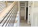 Modern entryway with staircase, featuring black iron railings and natural light; functional mudroom bench and storage at 55 Livingston Ln, Spring Hope, NC 27882
