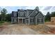 New construction home with a green exterior, black shutters and a lawn that will be installed at 55 Livingston Ln, Spring Hope, NC 27882