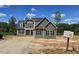 Inviting two-story home with vertical siding, black shutters, and symmetrical design at 55 Livingston Ln, Spring Hope, NC 27882