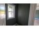 Hallway with green shiplap and a window at 55 Livingston Ln, Spring Hope, NC 27882