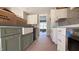 Kitchen with stainless appliances, white cabinets and gold hardware at 55 Livingston Ln, Spring Hope, NC 27882