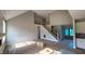 Open concept living room featuring a metal staircase railing and modern finishes at 55 Livingston Ln, Spring Hope, NC 27882