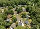 An aerial view of the neighborhood with lush greenery and manicured lawns at 5601 Preston Pl, Raleigh, NC 27604