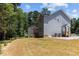 Exterior angle of a gray home with backyard at 5601 Preston Pl, Raleigh, NC 27604