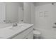 Clean bathroom featuring a single vanity, white subway tiled shower/tub combo, and attractive fixtures at 5601 Preston Pl, Raleigh, NC 27604