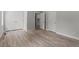 Spacious bedroom featuring hard surface floors, double closets and access to an ensuite at 5601 Preston Pl, Raleigh, NC 27604