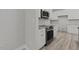 Stainless steel appliances and granite countertops featured in this modern kitchen at 5601 Preston Pl, Raleigh, NC 27604