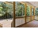Wood porch with railing, overlooking wooded area at 5601 Preston Pl, Raleigh, NC 27604