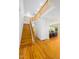 Inviting two-story entryway with a hardwood staircase, wood floors, and an open view to the living room at 574 Chatham Dr, Chapel Hill, NC 27516