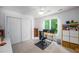 Bright home office with a large desk, closet, and natural light creating an ideal workspace at 574 Chatham Dr, Chapel Hill, NC 27516