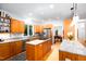 Spacious kitchen with custom wood cabinets, granite countertops, and stainless steel appliances at 574 Chatham Dr, Chapel Hill, NC 27516