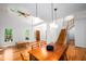 Bright open-concept living room/dining room with hardwood floors and natural light at 574 Chatham Dr, Chapel Hill, NC 27516