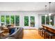 Bright living room with hardwood floors and access to the backyard at 574 Chatham Dr, Chapel Hill, NC 27516