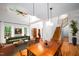 Staged open-concept living room/dining room with hardwood floors and modern furniture at 574 Chatham Dr, Chapel Hill, NC 27516