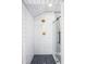 Step into this luxurious shower featuring sleek glass doors and unique shower head fixtures at 574 Chatham Dr, Chapel Hill, NC 27516