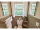 Bright and airy bathroom, neutral walls and a window overlooking the greenery at 582 Wimbleton Dr, Raleigh, NC 27609