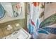 Bathroom featuring vintage-inspired decor, and a colorful floral shower curtain at 582 Wimbleton Dr, Raleigh, NC 27609