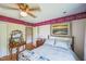 Relaxing bedroom with hardwood floors, hardwood furniture, and vibrant paint at 582 Wimbleton Dr, Raleigh, NC 27609