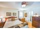 Cozy bedroom with hardwood floors, neutral walls, and ample natural light from the window at 582 Wimbleton Dr, Raleigh, NC 27609