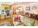 Inviting living room featuring hardwood floors and an open layout to the kitchen with bar seating at 582 Wimbleton Dr, Raleigh, NC 27609