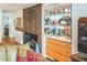 Living room featuring a decorative fireplace, hardwood floors, and display shelving at 582 Wimbleton Dr, Raleigh, NC 27609