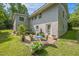 Brick patio features outdoor seating and lush landscaping, perfect for relaxing and entertaining at 582 Wimbleton Dr, Raleigh, NC 27609