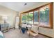 Bedroom featuring bright windows, sitting area, and neutral decor at 5822 Country Lane Dr, Durham, NC 27705