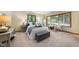 Cozy bedroom featuring neutral decor, large window, and lots of natural light at 5822 Country Lane Dr, Durham, NC 27705