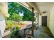 View from porch of brick home, overlooking the lush garden and driveway at 5822 Country Lane Dr, Durham, NC 27705