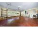 Spacious garage with a roll-up door, concrete floor, and room for parking and storage at 5822 Country Lane Dr, Durham, NC 27705