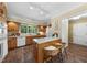 Spacious kitchen featuring stainless steel appliances, and kitchen island with seating at 5822 Country Lane Dr, Durham, NC 27705