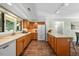Traditional style kitchen featuring wood cabinets, modern appliances, and tile floors at 5822 Country Lane Dr, Durham, NC 27705