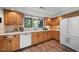 Bright kitchen featuring wood cabinets, stainless steel appliances, and tile floors at 5822 Country Lane Dr, Durham, NC 27705