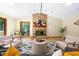 The comfortable living room features a brick fireplace and a large window offering scenic views of the lush green outdoors at 5822 Country Lane Dr, Durham, NC 27705