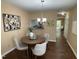 Charming dining area with stylish decor, pendant lighting, and view to adjacent living spaces at 600 Audobon Lake Dr # One B21, Durham, NC 27713