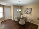 Inviting dining area featuring modern furnishings, stylish lighting, and convenient access to entry at 600 Audobon Lake Dr # One B21, Durham, NC 27713