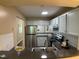 Bright kitchen features stainless steel appliances, ample counter space, and convenient layout at 600 Audobon Lake Dr # One B21, Durham, NC 27713