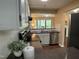 Modern kitchen featuring stainless steel appliances, white cabinetry, and convenient access to living areas at 600 Audobon Lake Dr # One B21, Durham, NC 27713