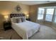 Serene main bedroom with a large window, neutral tones, and comfortable furnishings at 600 Audobon Lake Dr # One B21, Durham, NC 27713