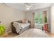 Bedroom with daybed and natural light from large windows at 6032 Epping Forest Dr, Raleigh, NC 27613