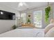 Serene bedroom with large windows and peaceful decor at 6032 Epping Forest Dr, Raleigh, NC 27613