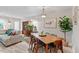 Open concept dining area with modern furniture and natural light at 6032 Epping Forest Dr, Raleigh, NC 27613