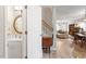 Inviting foyer with hardwood floors, a staircase, and views into the living spaces at 6032 Epping Forest Dr, Raleigh, NC 27613