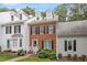 Beautiful exterior showcasing brick facade, multi-pane windows, and well-maintained landscaping at 6032 Epping Forest Dr, Raleigh, NC 27613