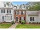 Charming brick townhome with manicured lawn and inviting walkway at 6032 Epping Forest Dr, Raleigh, NC 27613