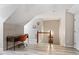Versatile loft space with a desk area, neutral walls, and modern flooring at 6032 Epping Forest Dr, Raleigh, NC 27613