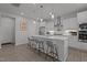 Spacious kitchen featuring a large island with seating, pendant lighting, and stainless steel appliances at 604 Craftsman Ridge Trail Trl, Knightdale, NC 27545