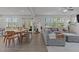 Open-concept living room featuring hardwood floors, a large sectional sofa, and natural light at 604 Craftsman Ridge Trail Trl, Knightdale, NC 27545
